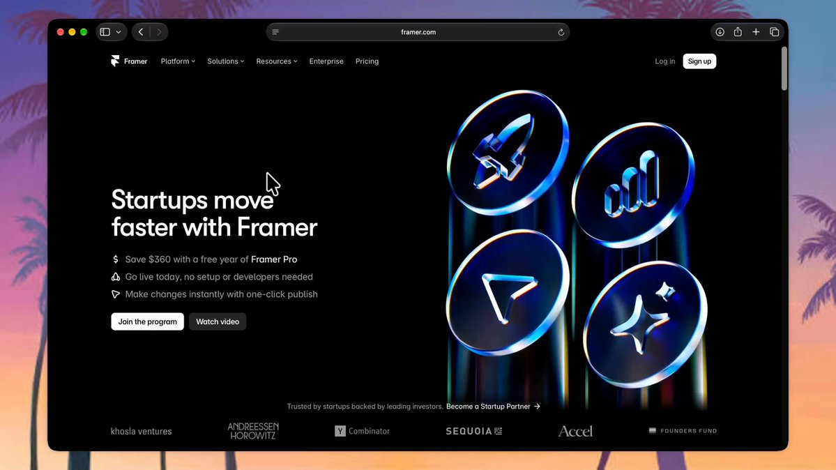 Modern startup workspace with dual monitors displaying the Framer for Startups program application portal and interactive web design canvas